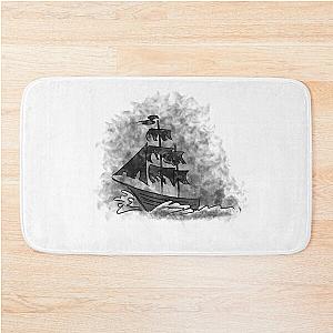 a ship with black sails floats on the waves Bath Mat
