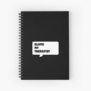Blame my therapist in a funny retro arcade style with black and white speech bubbles in dark mode on a spiral notebook.