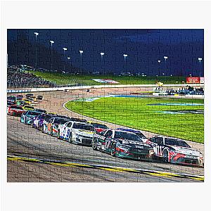 Chris Buescher and Denny Hamlin leading the pack at Kansas Speedway