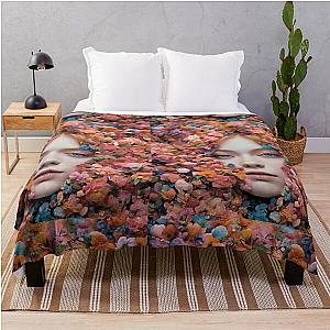 Elle Fanning's face between flowers throw blanket