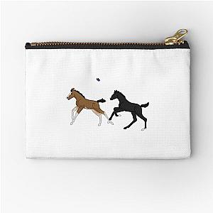 Foals playing with a zipper pouch