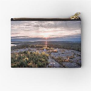 A sunset over James Bay in Canada Zipper Pouch