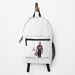 Kevin Magnussen drives a backpack