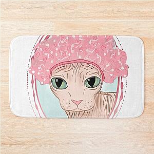 Hairless Sphynx Cat Wearing a Pink Shower Cap Bath Mat