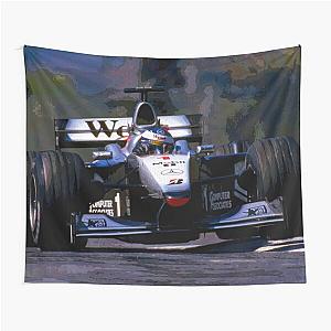 Mika Hakkinen racing his 1999 MP4-14 F1 race car on a tapestry