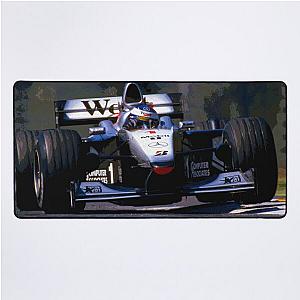 Mika Hakkinen racing his 1999 MP4 14 F1 racecar abstract Desk Mat
