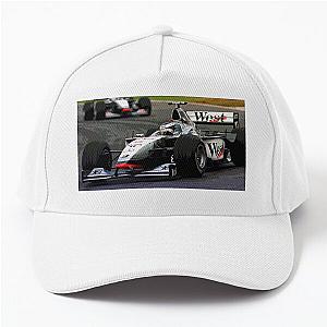 Mika Häkkinen Racing His 1998 MP4-13 F1 Racecar Wearing a Baseball Cap