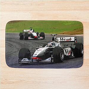 Mika Hakkinen racing his 1998 MP4-13 F1 race car with Bath Mat