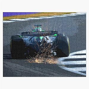 Nico Hulkenberg racing to his first podium at Silverstone during the 2025 British Grand Prix from the rear with sparks.