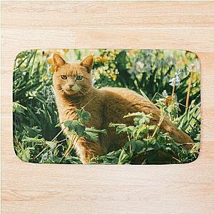 Colorful cat in the garden hiding says hey to you! Bath Mat