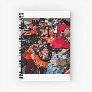 Tony Stewart signing kids' shirt and spiral notebook